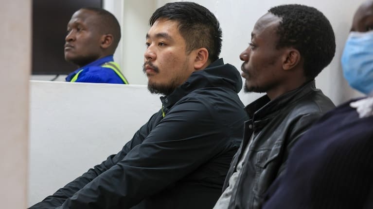Zhang Kequn, a Chinese national and Charles Mwangi, a Kenyan citizen, are presented in court for smuggling live queen garden ants at Jomo Kenyatta International Airport Law Courts in Nairobi, Kenya.