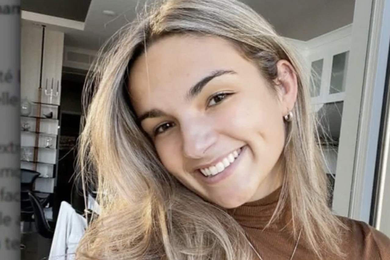 Head and shoulders shot of smiling woman.