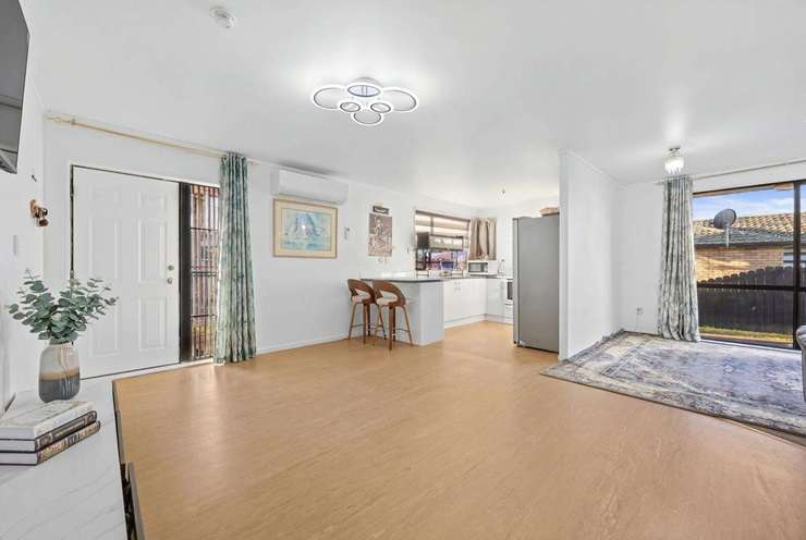 Zuhaib Bangash's four-bedroom home on Woodbank Drive, in Auckland's Glen Eden, was listed with a Ray White agent who has a track record of beating the bank. Photo / Supplied