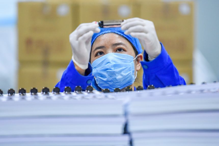 A worker inspects bioactive peptides at a workshop of Hubei Reborn Biotech Co., Ltd on November 17, 2020 in Jingzhou, Hubei Province of China.