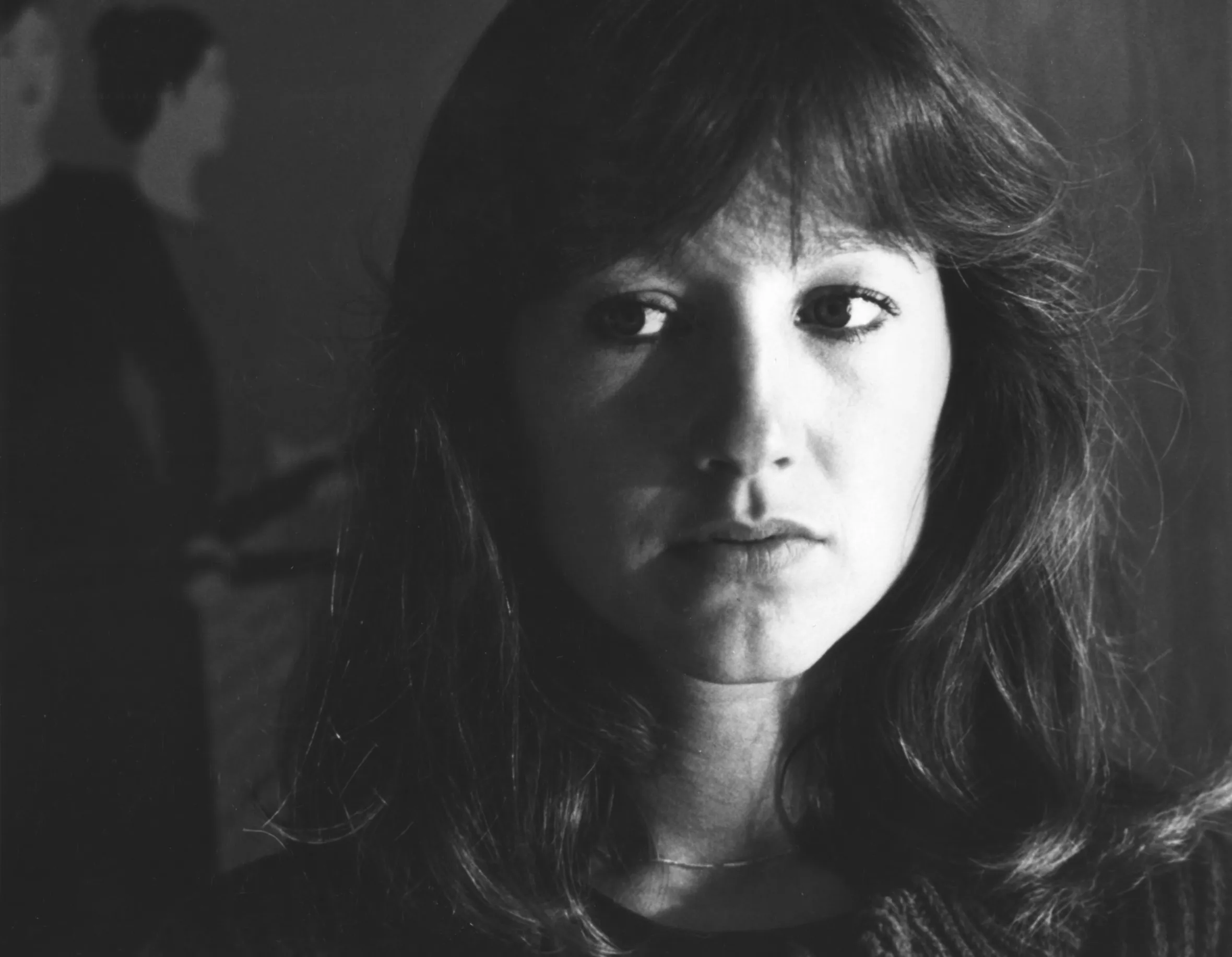 Nathalie Baye in a close-up, looking into the camera.