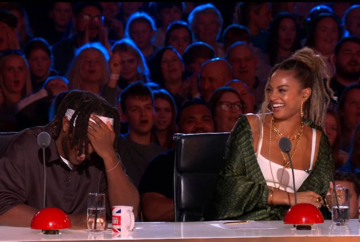 KSI covers his face as Christy Coysh performed on BGT