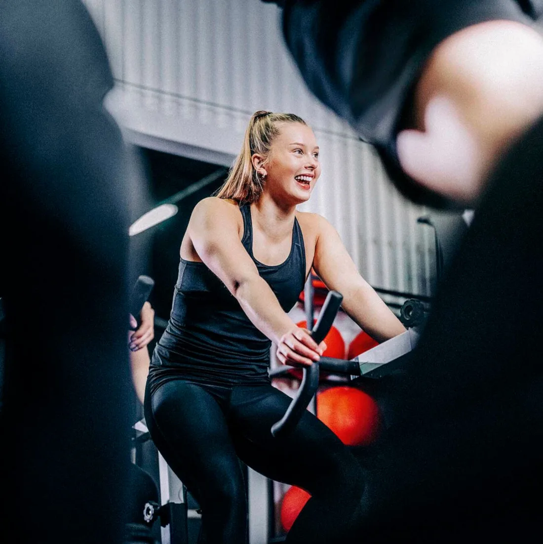 Photo of a happy person on an exercise bike