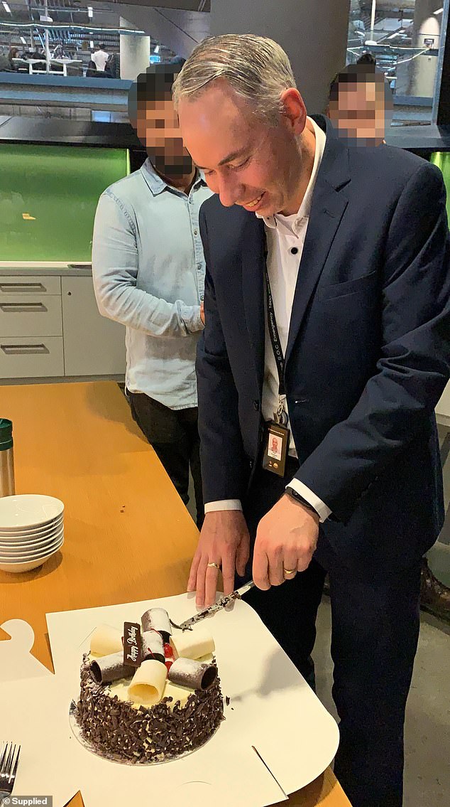 Former NAB employee John Horwood, 49, contemplated suicide on the rooftop of the bank's Melbourne skyscraper after being made redundant. He is seen celebrating his birthday at work