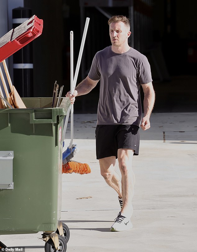 Adam Bouris was pictured clearing out the company's warehouse on Tuesday