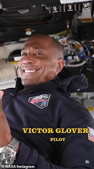 Pilot Victor Glover flashed a thumbs up