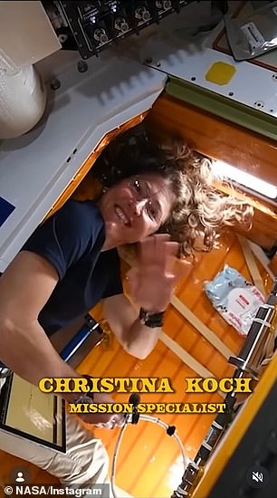 Mission specialist #1 Christina Koch waved as her curly hair floated above her head in zero gravity