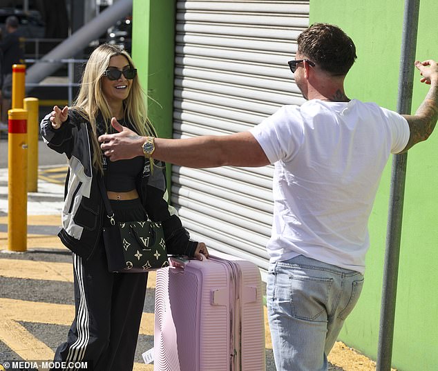 The famous blonde was quick to turn her frown upside down when she spotted her on-screen 'bestie' Chris Robinson