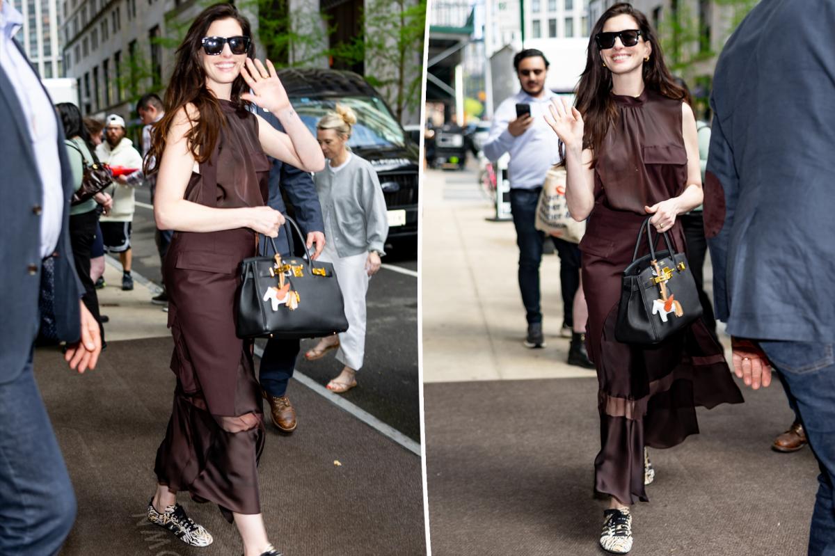 Anne Hathaway wears Adidas Tokyo sneakers during 'Devil Wears Prada' press tour