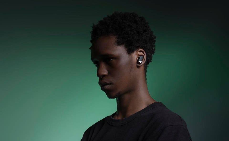 Man wearing Status Audio Pro X earbuds