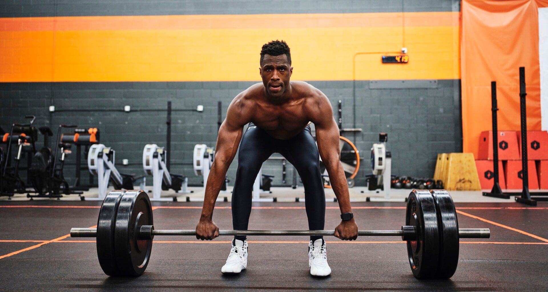 man in gym preparing to lift