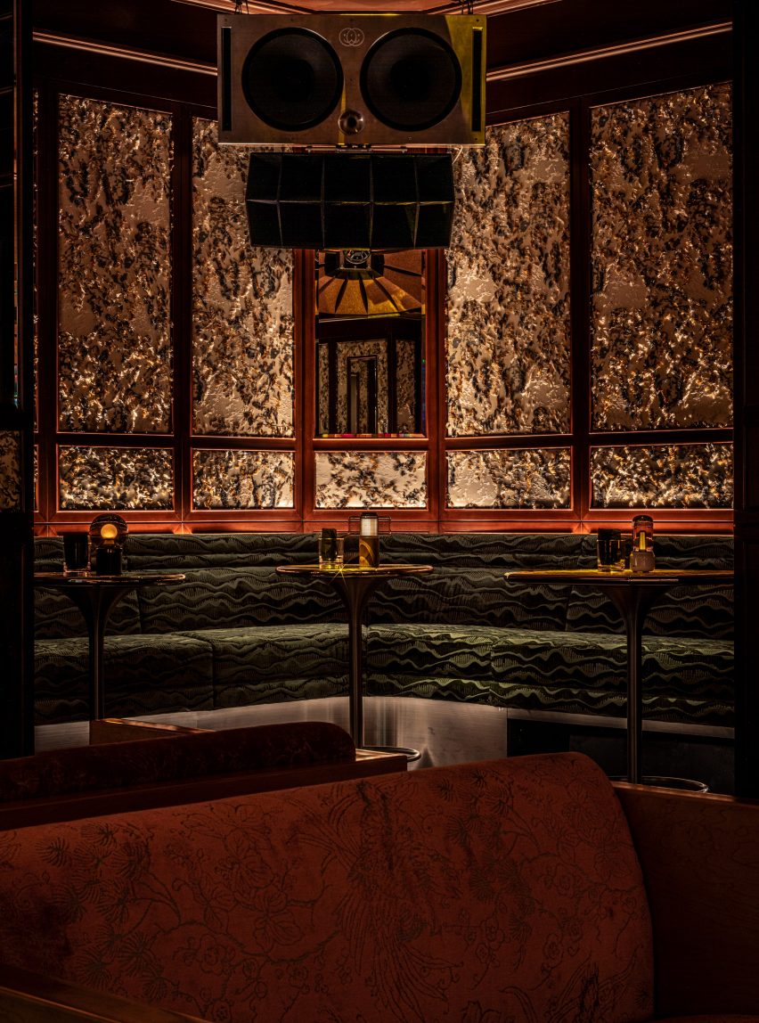 Green-hued banquettes within Dragon-i