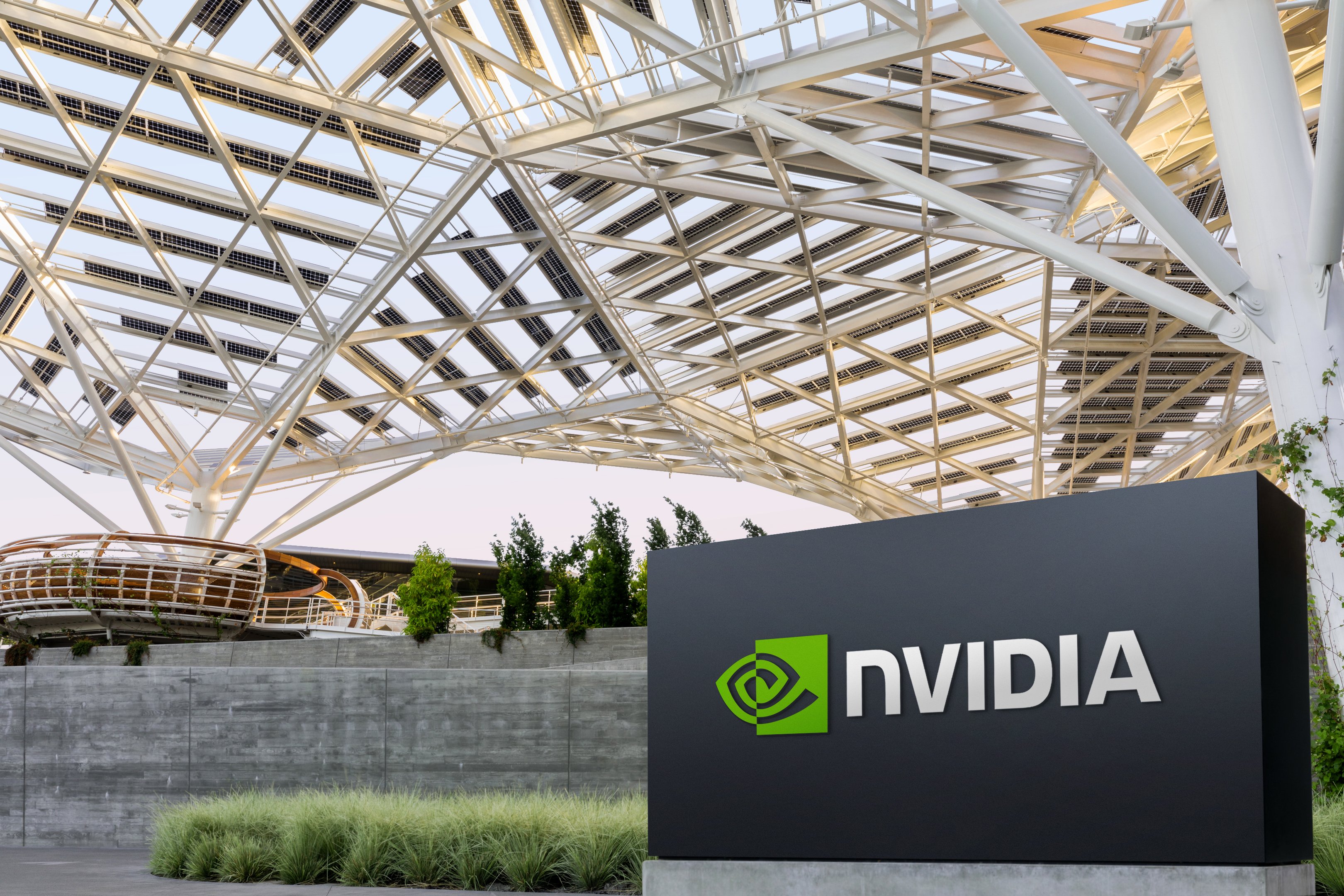 The Nvidia logo on a sign in front of the company's Voyager headquarters. 
