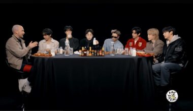 Members of BTS sit with host Sean Evans, left, during their appearance on YouTube talk show “Hot Ones,” taking on progressively spicier wings while answering questions. Captured from First We Feast YouTube Channel