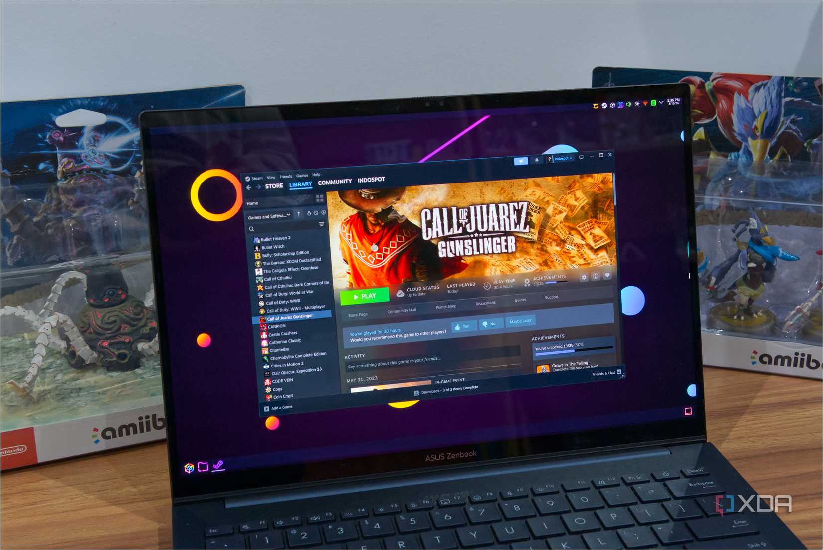 A laptop showing the Steam library page for the game Call of Juarez: Gunslinger