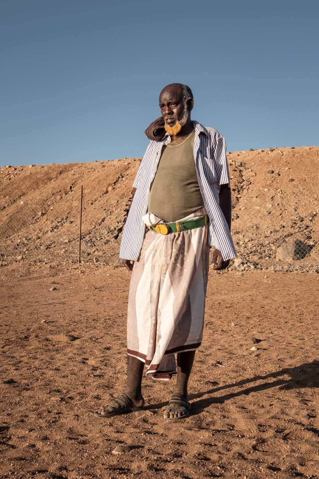 Abdi Gueleh, one of a group of farmers who benefited from a Great Green Wall backed project, surveys the remains of his once-thriving farm in Kourtemale, Djibouti.
