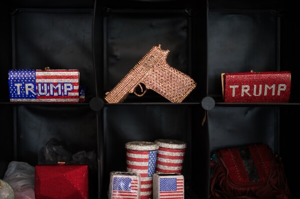 US flag symbol merchandise and other rhinestone-studded items are displayed at the California Republican Party Convention in San Diego, Saturday, April 11, 2026. (AP Photo/Jae C. Hong)