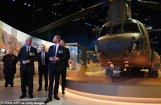 Britain's Prince Harry, the Duke of Sussex walks past a Chinook helicopter in the Anzac Hall of the museum during a visit to the Australian War Memorial in Canberra on April 15, 2026. (Photo by Jonathan Brady / POOL / AFP via Getty Images)
