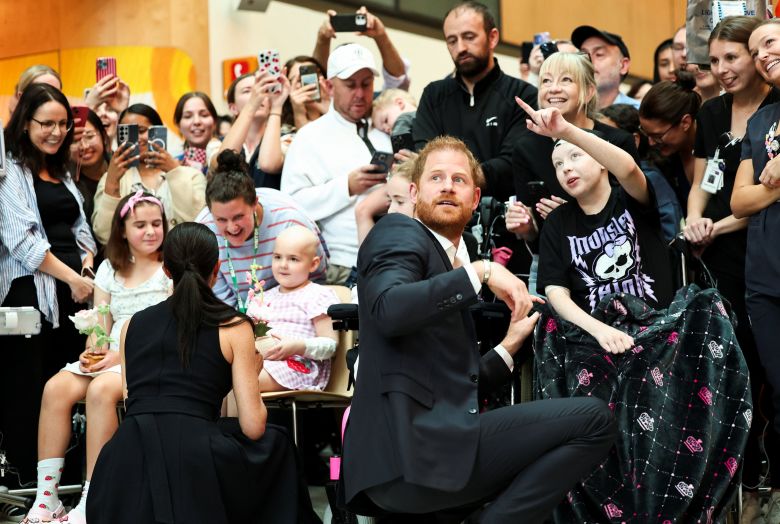 Prince Harry and Meghan interact with children during their visit to the Royal Children's Hospital in Melbourne, Australia, April 14, 2026.