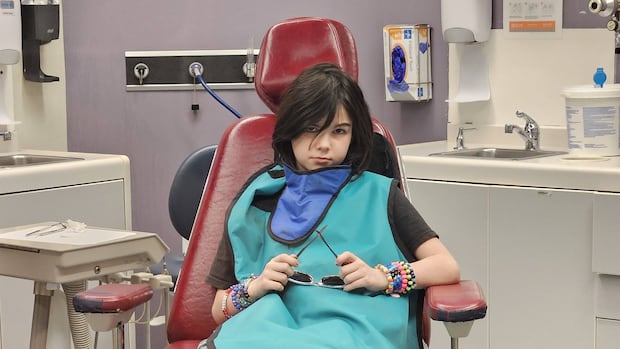 N.B. child still waiting for dental surgery after two years
