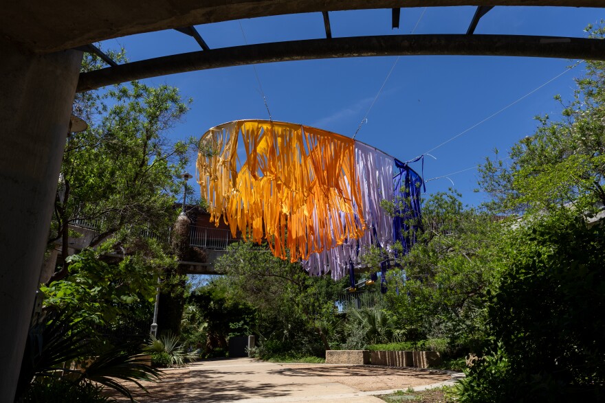 ‘Sunclipse’ by the enFold Collective catches the sunlight in the Pfluger Pedestrian Bridge Circle in Austin, Texas, on April 6, 2026. Joe Ferrara / KUT News