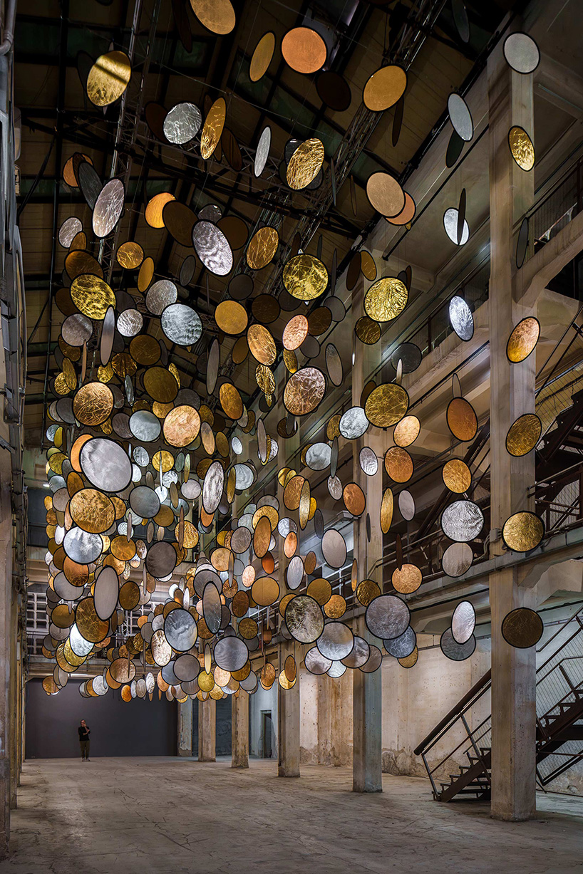 SpY’s kinetic installation suspends rotating gold and silver halos inside florence atrium - 6