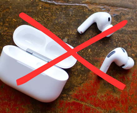 Crossed out Apple AirPods 3 Pro on a table.