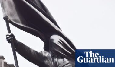 Statue with Banksy signature of man blinded by flag appears in London | Banksy
