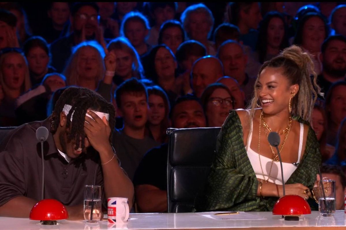 KSI covers his face as Christy Coysh performed on BGT 