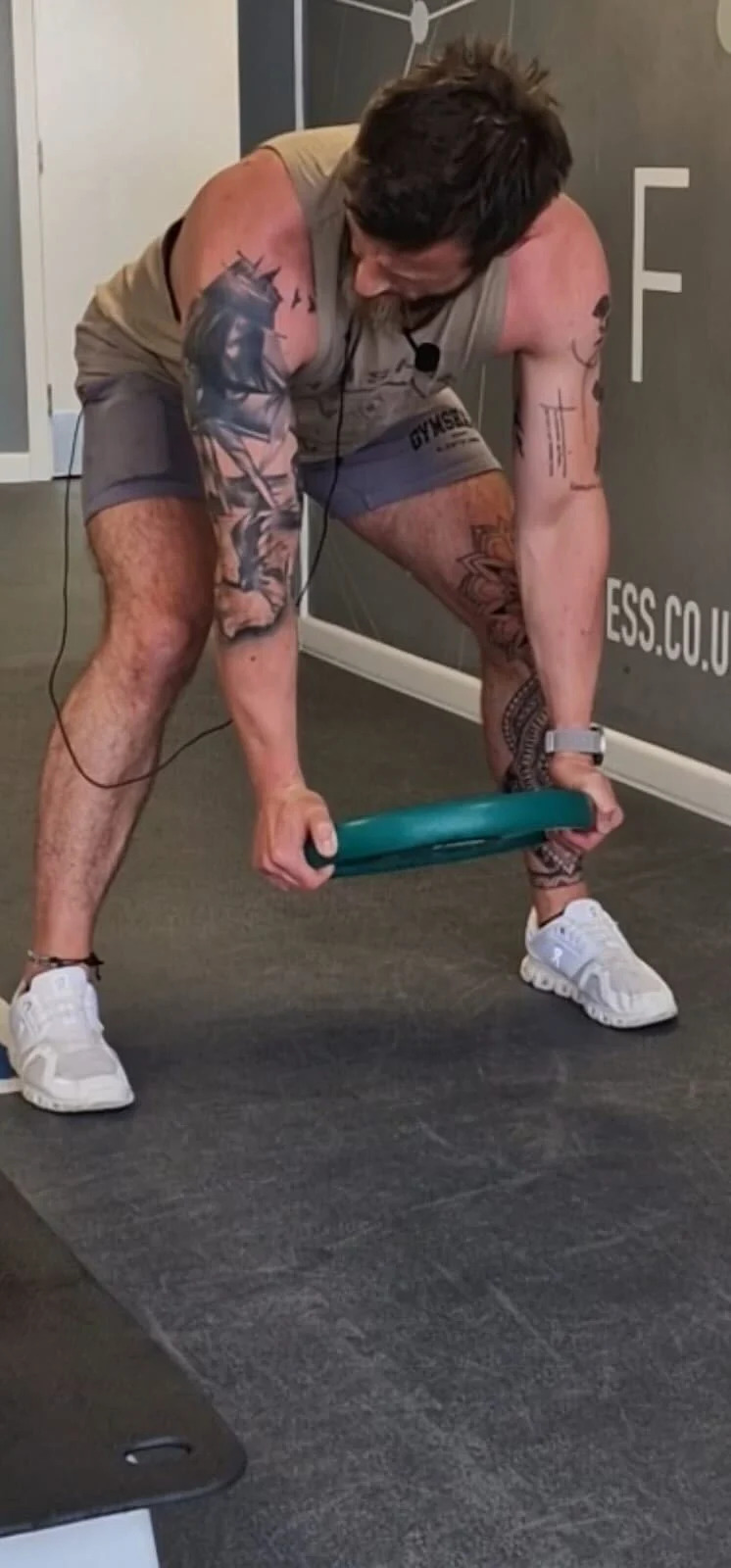 Gordy lifting a weight at the gym