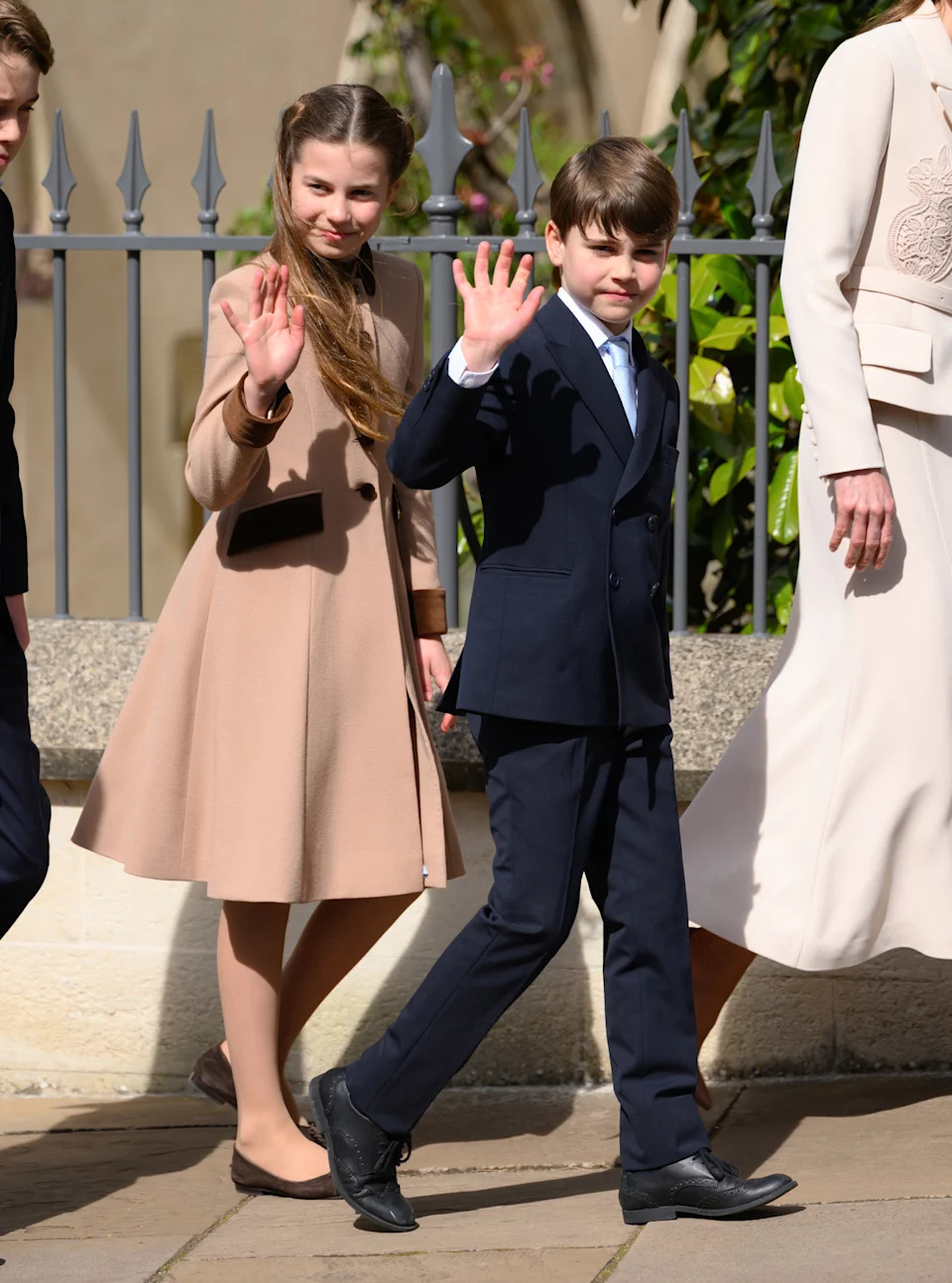 Princess Charlotte and Prince Louis wave at royal fans after the Royal Family's 2026 Easter Matins Service at St George's Chapel on April 05, 2026