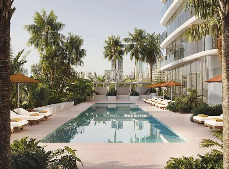 Kiwi developer Danny Andrews with his daughter and his firm's general manager, Sarah Daniels. They have just launched their A$900 million South Beach apartment project on Queensland’s Gold Coast. Photo / Supplied