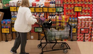 Food shoppers browse the aisles for groceries ahead of the Thanksgiving Day holiday in Redmond