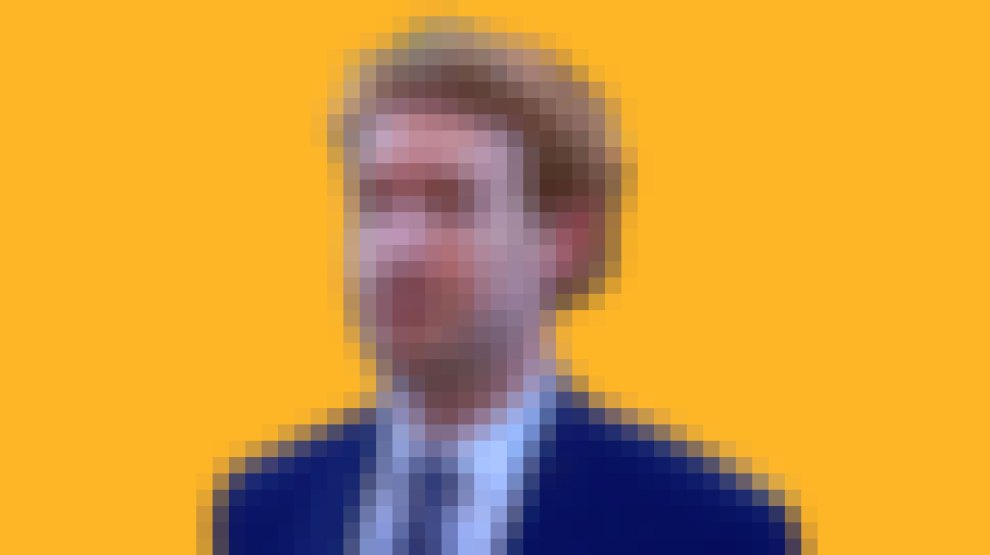 A pixelated close-up portrait of a person wearing a blue suit against a solid yellow-orange background.