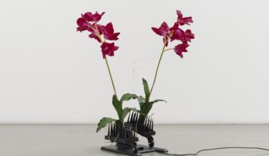 Anthropomorphic sculptures made of fake flowers and neck massagers