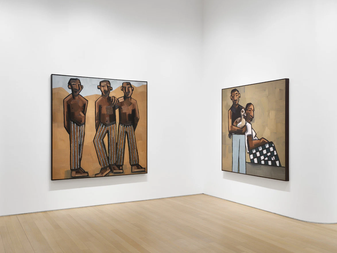 Art gallery room with two paintings depicting abstract human figures on white walls and wooden floor.