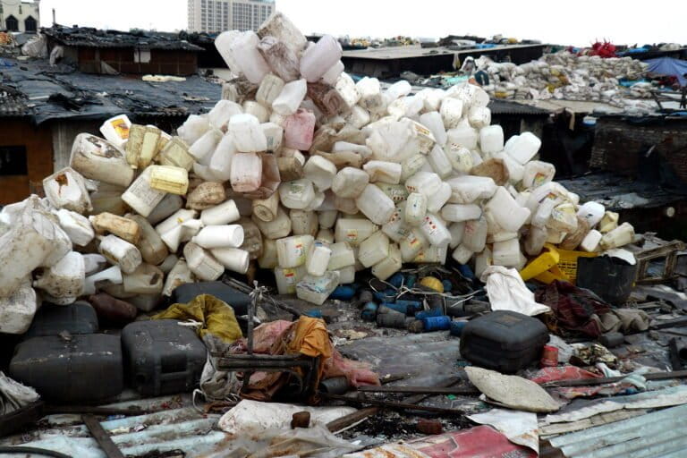 Plastic cans assembled at a recycling unit in Mumbai, Maharashtra. Image by Cory Doctorow via Flickr (CC BY-SA 2.0).