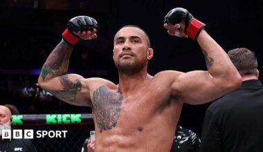 Carlos Ulberg celebrates after beating Dominick Reyes in September 2025