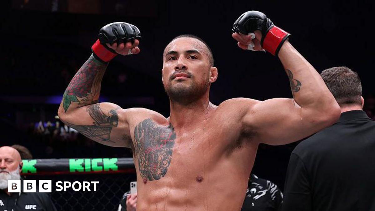 Carlos Ulberg celebrates after beating Dominick Reyes in September 2025