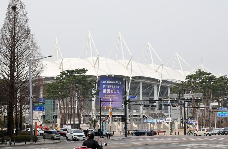 A banner welcoming BTS' world tour hangs at Goyang Stadium, in Goyang, Gyeonggi Province, Sunday. Goyang, the first stop on BTS' 34-city world tour, is preparing a series of welcome events ahead of the group's concerts on April 9, 11 and 12. Yonhap