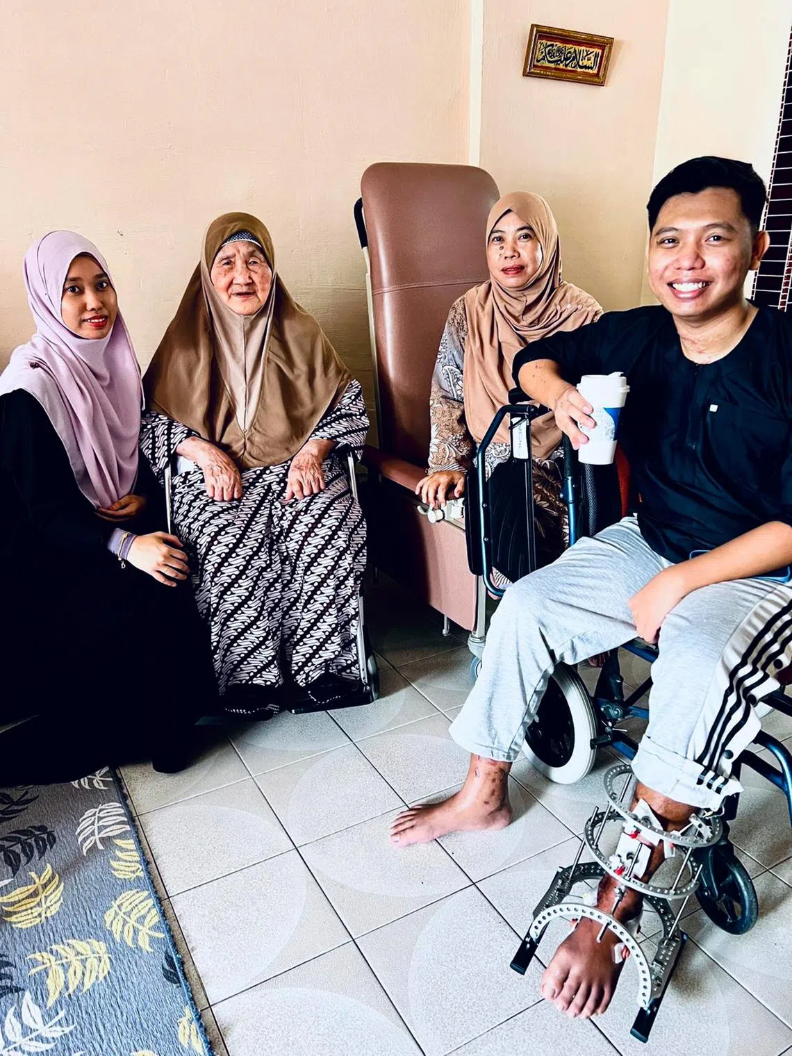 Mr Mahmud with (from left) his sister, grandmother and mother in May 2022.