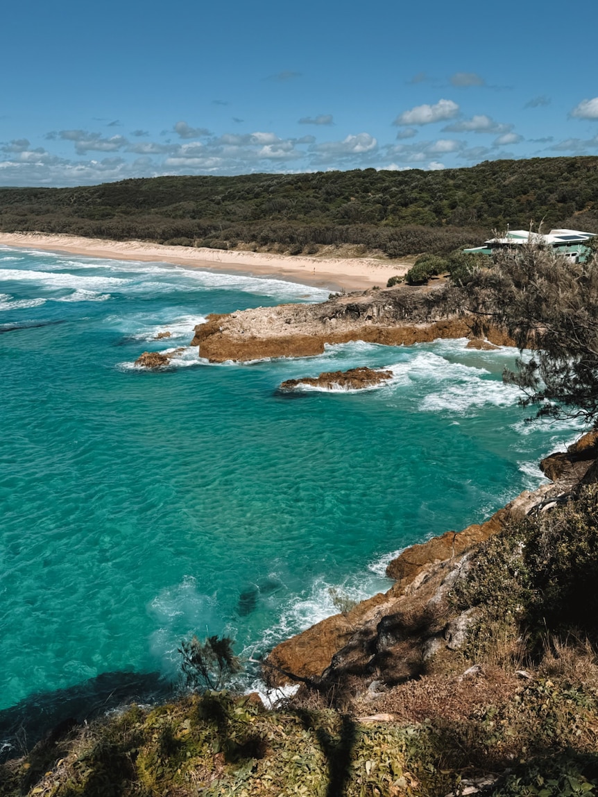 The ocean and a surf club situated on some cliffs