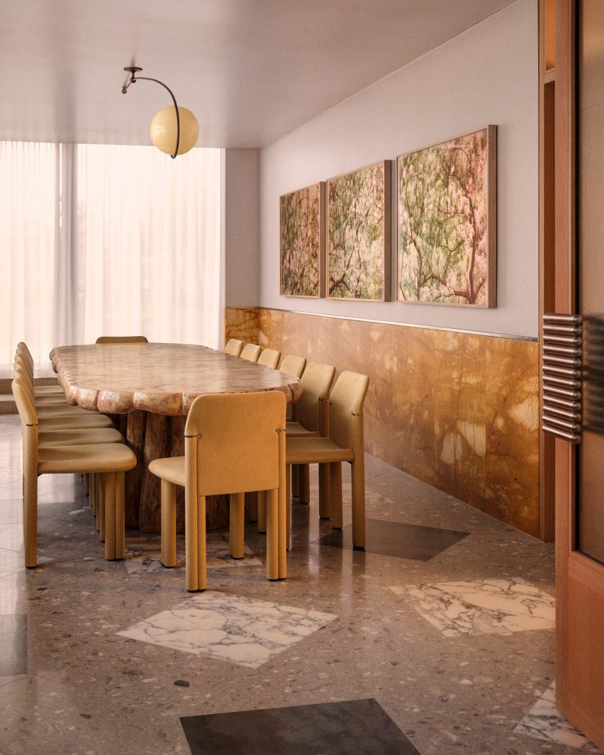 Burl wood table and colourful paintings