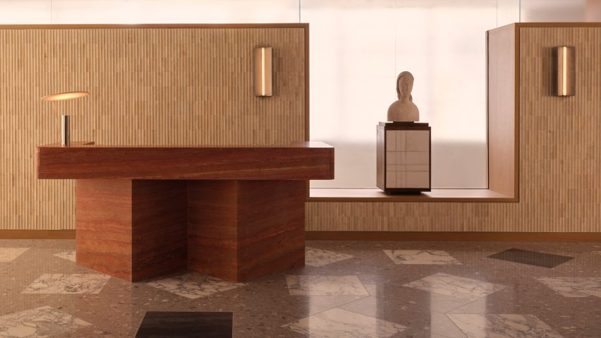 Wooden desk next to sculpture