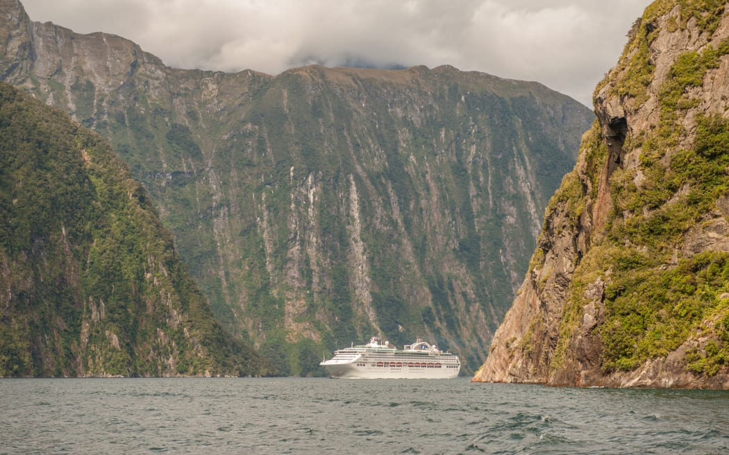 Milford Sound, New Zealand February 14, 2012: Cruise ship cruising in Milford Sound. This fiord is considered as one of the most scenic places in the world.