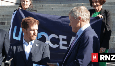 Ultra-marathon swimmer Jono Ridler delivers petition to ban bottom trawling to Parliament