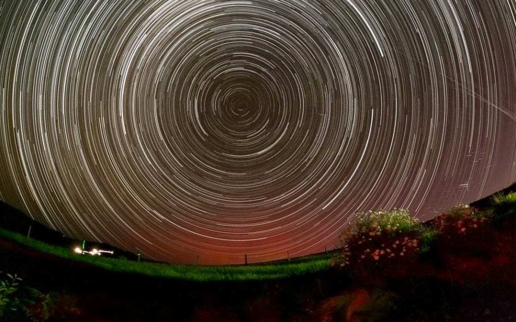 A long exposure image of the night sky from Star Safari Observatory in Carterton showing stars as concentric circles, with satellites clearly visible as short lines in the lower right quadrant. PHOTO/SUPPLIED