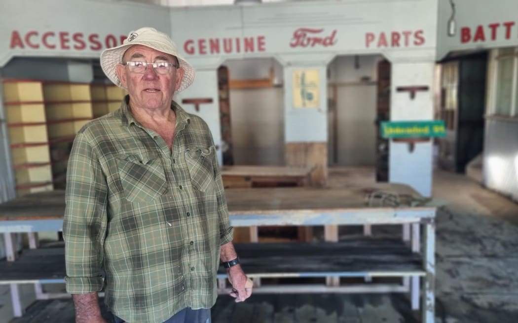 Stewart Mckenzie owns the Kallil Motors Building in Ōhura. Built in the 1920s, etched on its wall is a record of all the times floodwaters have entered the building.