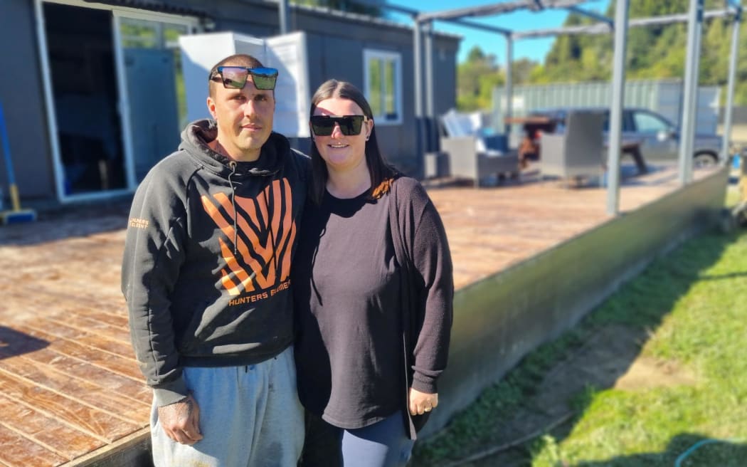 Gene and Hayley McBride's children age 6 and 10 had to be floated off there Kiwi St property which was covered in should high flood waters.