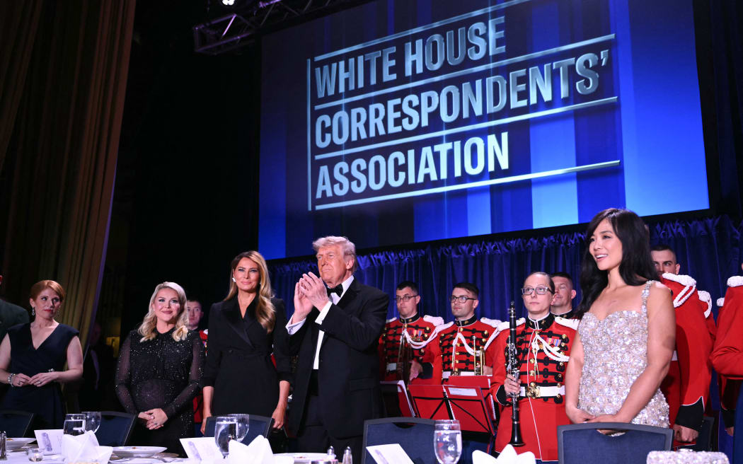 (L/R) Journalist Karen Travers, White House Press Secretary Karoline Leavitt, US First Lady Melania Trump, US President Donald Trump and CBS News senior White House correspondent Weijia Jiang attend the White House Correspondents' dinner at the Washington Hilton in Washington, DC, on April 25, 2026. President Trump is attending the annual gala of the political press for the first time while in office. (Photo by Mandel NGAN / AFP)